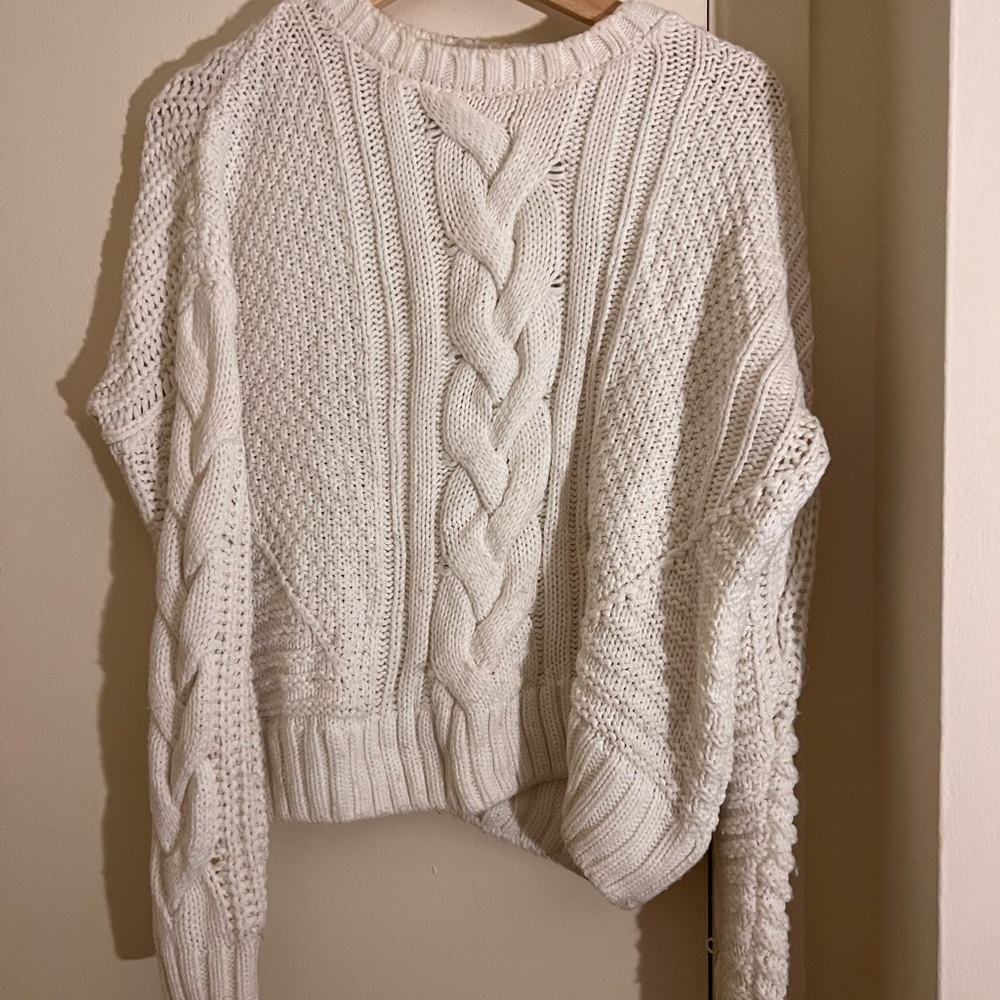 White cropped sweater with braid down the middle